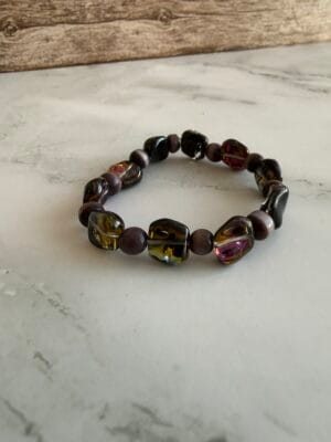 צמיד גמיש חרוזים שטוחים ורוד וסגול