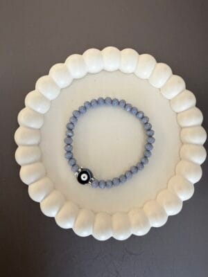 צמיד גמיש קריסטל אפור עין שחורה