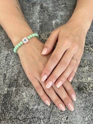 צמיד גמיש קריסטל ירוק עין ורודה